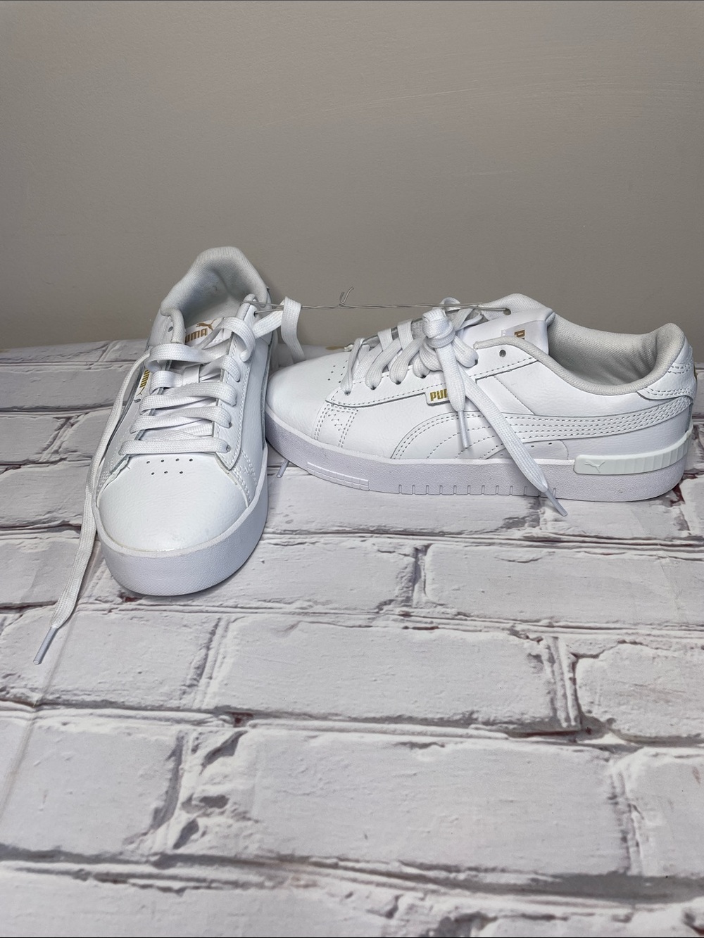 Puma White Leather Low-Top Sneakers with Gold Accents